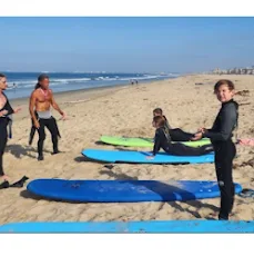 Surfboards and students preparing on the beach