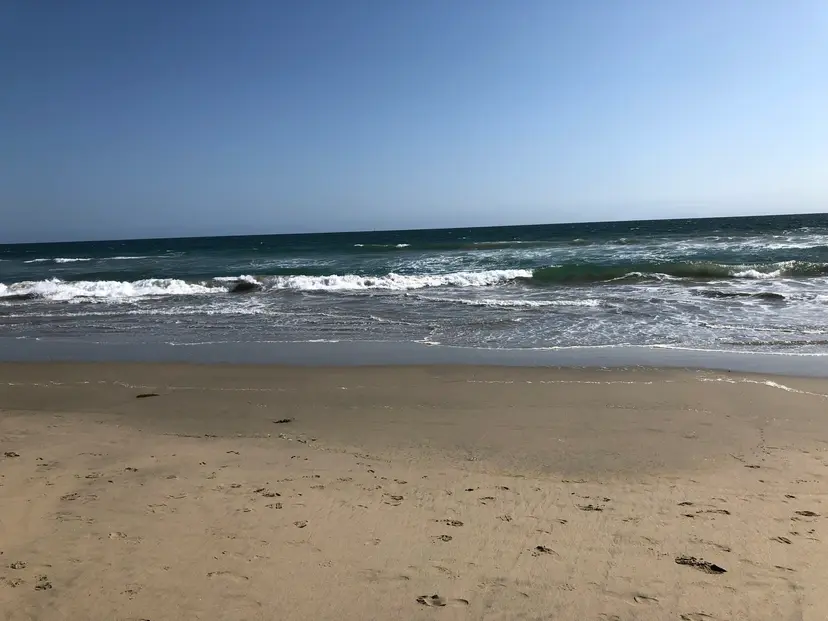 Waves breaking on the wide sand of Huntington State Beach