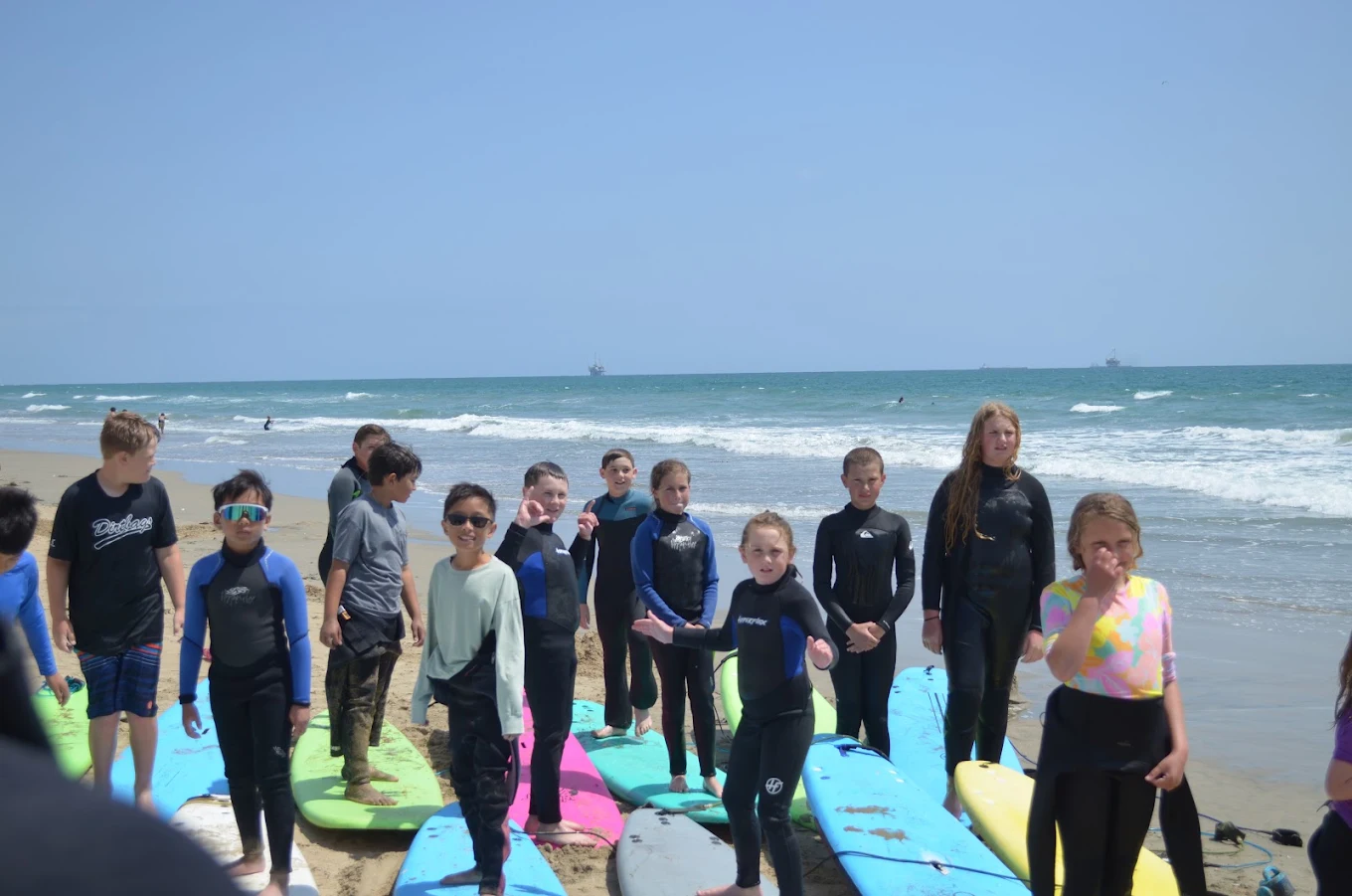 Surfiscool students with surfboards at Huntington Beach